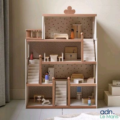 a doll house with a lot of furniture in it