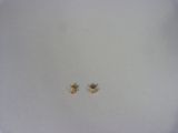 two small gold stars on a white plate