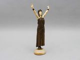 an image of a statue of a woman holding her hands up