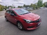 a picture of a red car parked on the side of the road