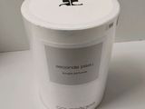 a white container sitting on a table with a lid