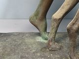 statue of a man with a horse on a stone base