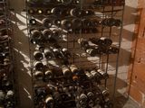 many bottles of wine on the racks in the room
