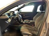 the interior of a car with the door open showing the driver ' s seat
