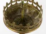 a gold plate with a bird on top of it