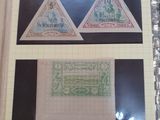 three different types of stamps on a piece of paper on a table