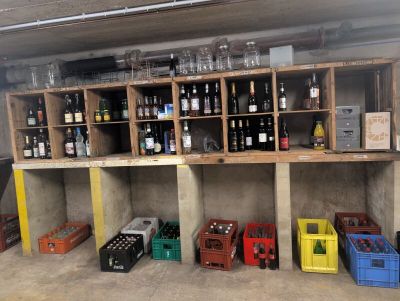 many bottles of wine on the shelves in the garage
