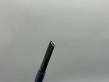 a pen that is sitting in a cup on the table
