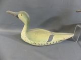 two ducks that are sitting next to each other on a table