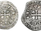 une pièce d'argent avec une croix au recto et une croix au verso