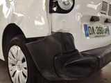 a white car with a black seat on the front of it