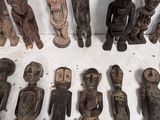 a lot of wooden figurines that are sitting on a table