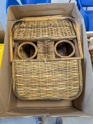 a cardboard box with a wicker face inside of it