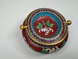 a red and blue box with a flower design on it