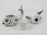 two small cups sitting next to each other on a table
