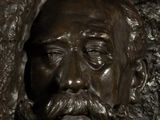 a statue of a man with a moustache on his face