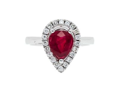 a pear shaped ruby and diamond ring set in 18k white gold