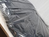 a plastic sheet wrapped around the back of a chair