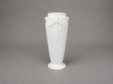 a white vase with a bow on it on a gray background