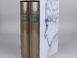 two books in a white box with a drawing of a woman ' s face on it