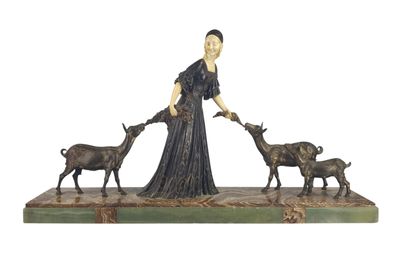 statue of a woman with goats and a dog on a green base