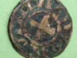 a small coin with a picture of a man on it