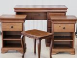 a wooden desk with two drawers and a small stool