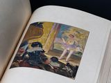 an open book with a picture of a ballerina on it