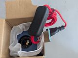 a box with a cord in it and a cord plugged into it