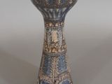 a blue and white vase sitting on a table