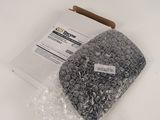 a bag of plastic beads sitting on top of a white table