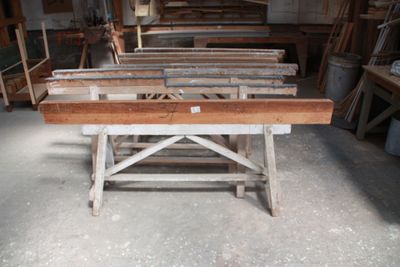 many pieces of wood sitting on a table in a room