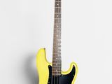 yellow electric bass guitar on white background with copy space for text