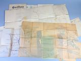 a lot of old maps on a blue table