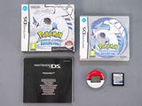 a nintendo ds game next to a game case and a game controller