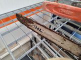 a chainsaw that is sitting on a rack in a store