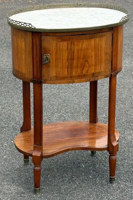 a wooden table with a marble top on it