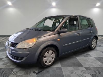 a picture of a small gray car in a room
