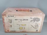 a box with a toy gun and other items in it