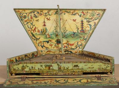 a green and yellow box with a painting on it