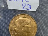 a gold coin with a small piece of writing on it