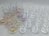 a lot of glasses that are sitting on a table
