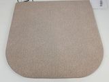 a close up of a beige rug on a white table