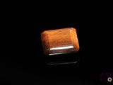 an image of a wooden object on a black surface