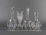 a group of glass vases sitting on a table