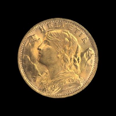 gros plan d'une pièce d'or sur fond noir