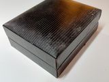 a black box that is sitting on a white table