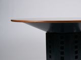 a black table with a wooden top on a white background