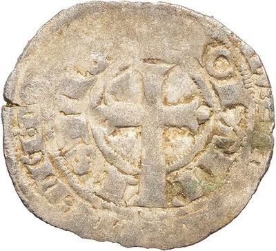 a close up of a coin with a cross on it