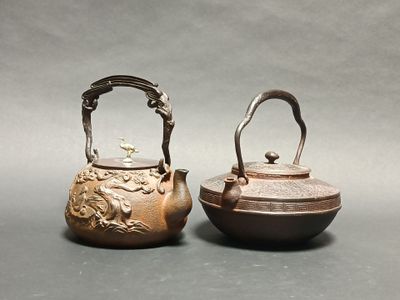 pair of chinese bronze teapots with handles and handles